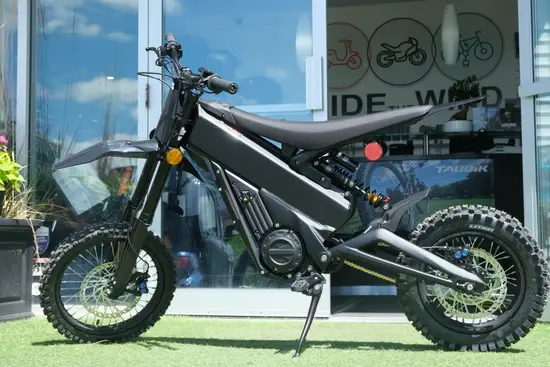 Talaria X3 Mini Lite electric dirt bike riding-ready on a rugged Australian off-road track