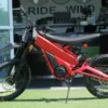 Red Talaria X3 Pro electric dirt bike for sale in Australia, side profile showing off-road knobby tyres, disc brakes, and lightweight frame — ideal electric trail bike for Aussie riders